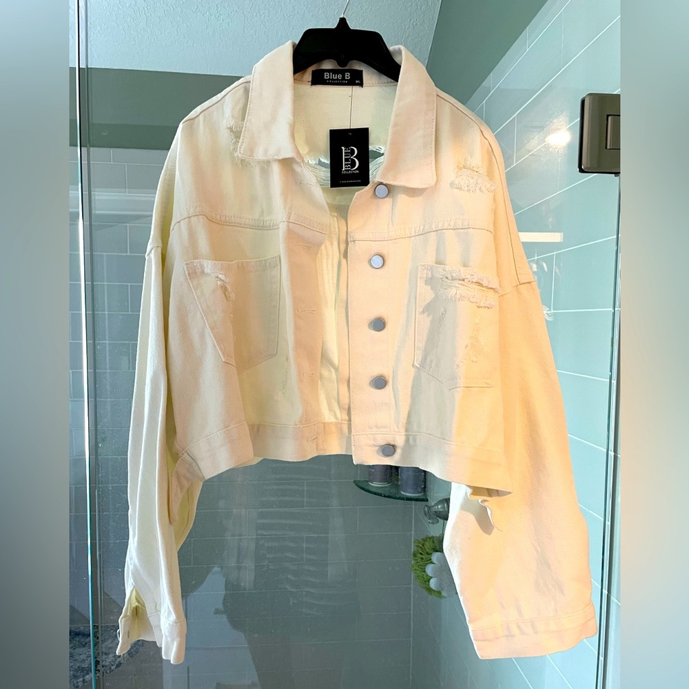 New White denim slightly cropped with rhinestone fringe